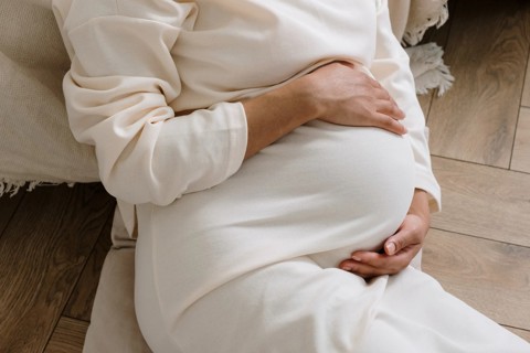 Pregnant Woman Sitting Down