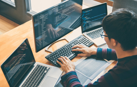 Software Developer Working On Computer