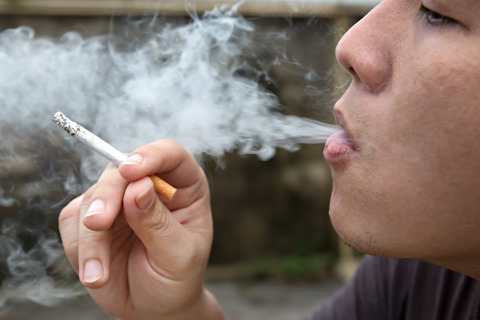 Man Smoking A Cigarette