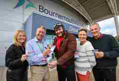 DRWF Team and others, holding the new Diabetes Travel Checklist at Bournemouth Airport
