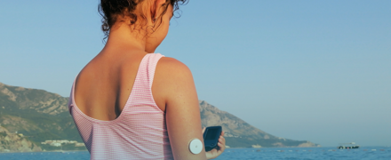 Girl With CGM On Arm Sea Banner