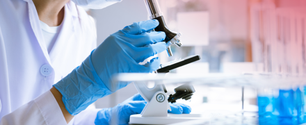 Medical Researcher Microscope Banner RED TR