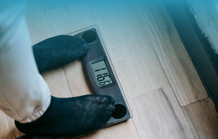 Person Weighing On A Scale Banner
