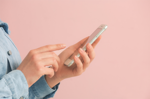 A Person Using Their Mobile Phone R