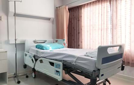 Empty Hospital Bed For Patient