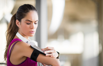 Sportswoman With Wearable Device