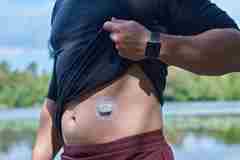 A person wearing a CGM.