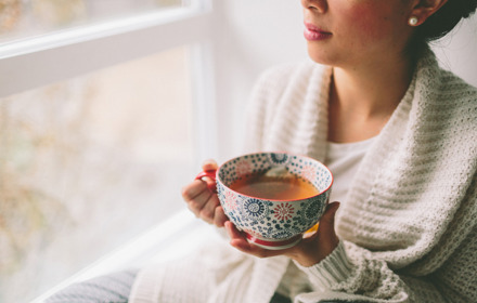 Woman Having A Cup Of Tea Indoor