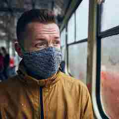 Man Wearing Face Mask On Public Transport