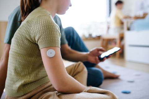 Girl With CGM On Her Arm Phone 1