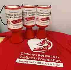 DRWF fundraising shirt and collection cups. 